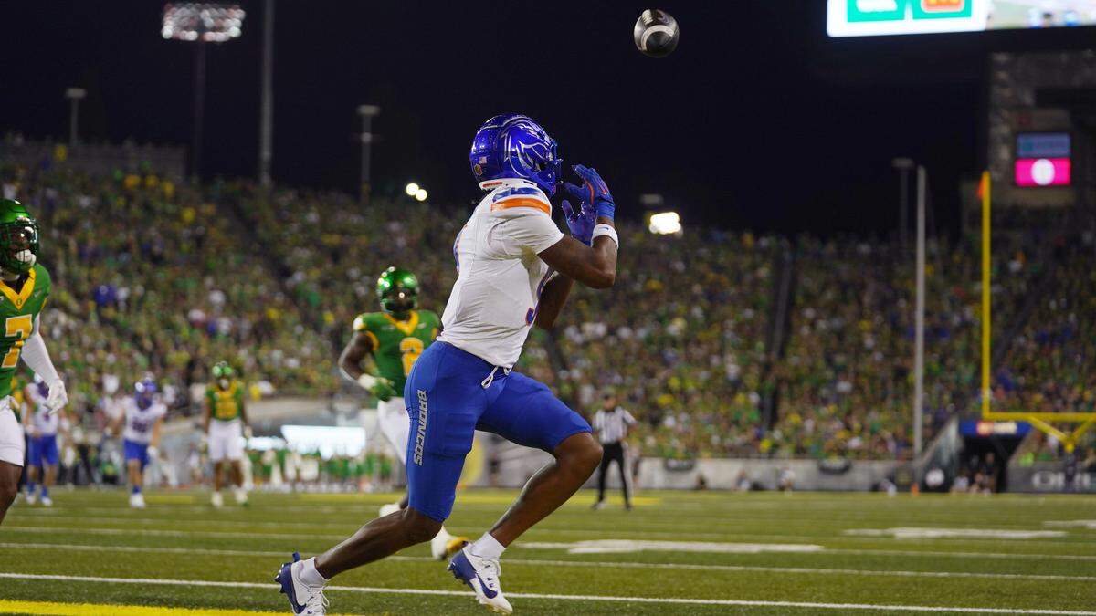 Boise State wide receiver Cam Camper catches a pass from quarterback Maddux Madsen for a touchdown against No. 7 Oregon on Sept. 7, 2024.