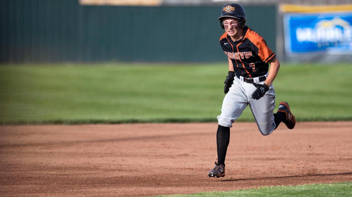 Ridgevue junior catcher Colton Bowman sprints to third base to complete a two-run triple as part of the Warhawks’ five-run first inning Thursday.