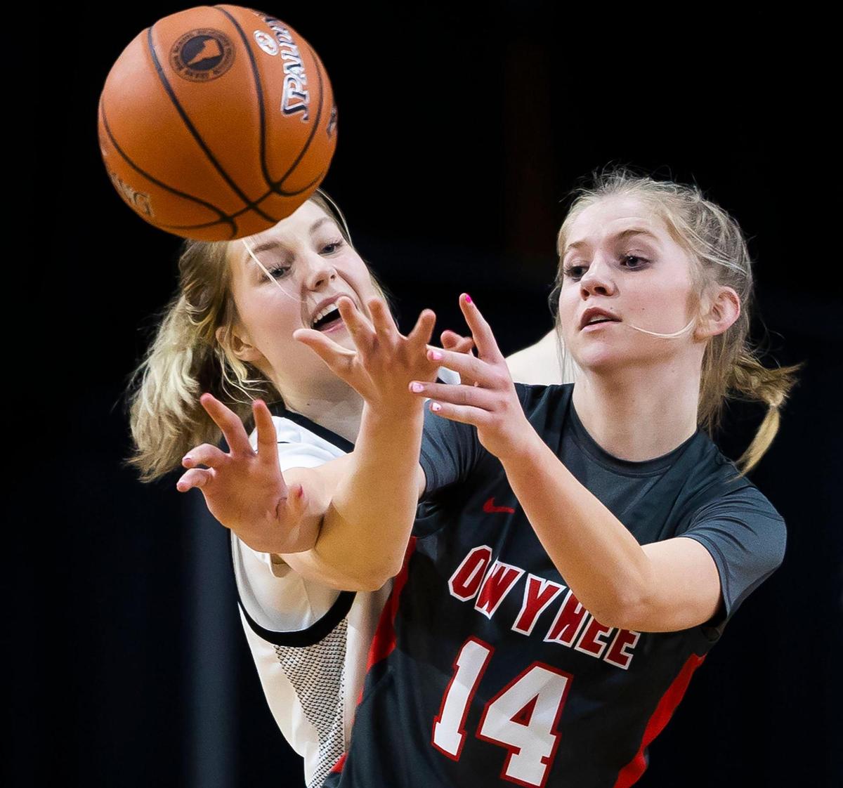 Boise center Alex Gustavel pops the ball out of Owyhee guard Riley Beck’s hands Thursday at the Ford Idaho Center.