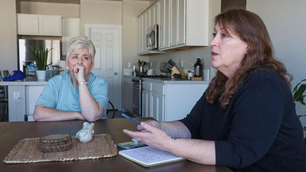 “Right now we have 200 homes being occupied that we have zero say in what’s going on,” said Silver Trail homeowner Karen Erwin, right, with Laura Adkins, as they discuss the frustration they have with not being kept informed about how homeowners association money is being spent.