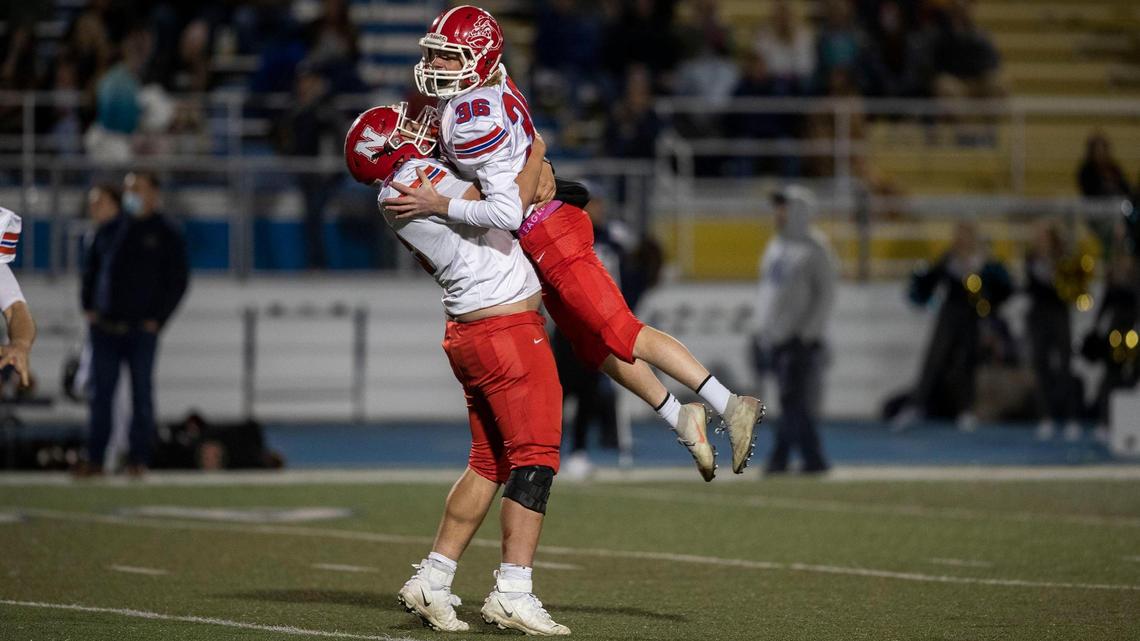 Nampa kicker Lance Hanna is hoisted into the air by teammate Mason Rydalch after a game-winning 42-yard field goal with 6 seconds left on the clock. The Bulldogs defeated Middleton 44-42 in the first round of the 4A state playoffs Friday, Oct. 30, 2020, at Middleton High School.