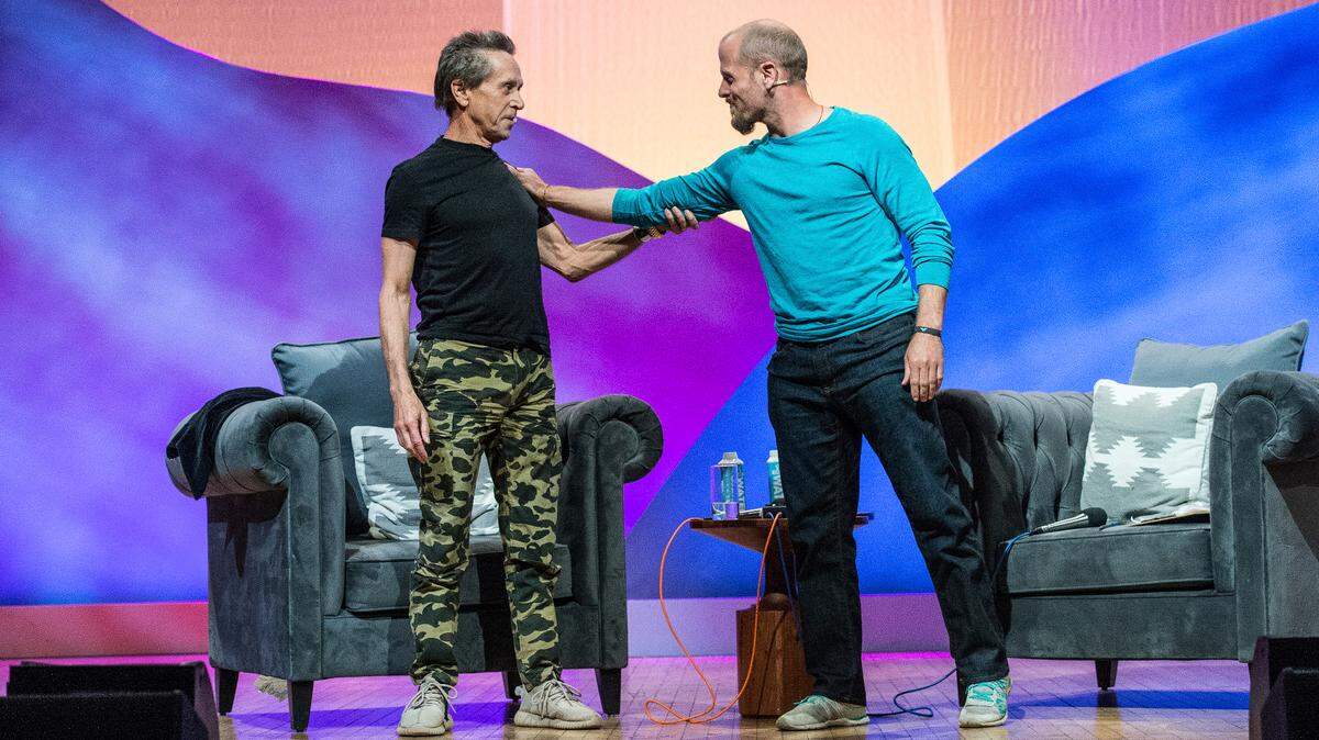 Tim Ferriss, right, interviews Hollywood producer Brian Grazer, cofounder of Imagine Entertainment, at Summit LA17 in Los Angeles in 2017. Ferriss’ podcasts are worth hearing, Nancy Napier writes.