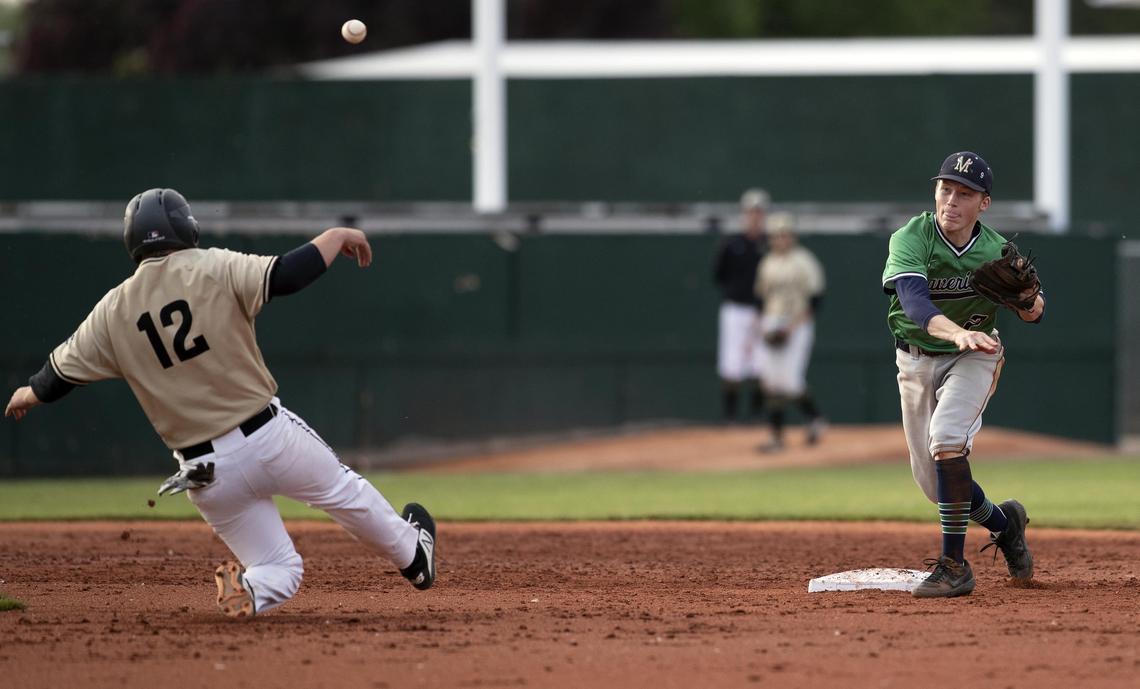Mountain View second baseman Carson Smith converts a double play during the 5A state championship game as Capital’s Josh Berg slides in the second inning.