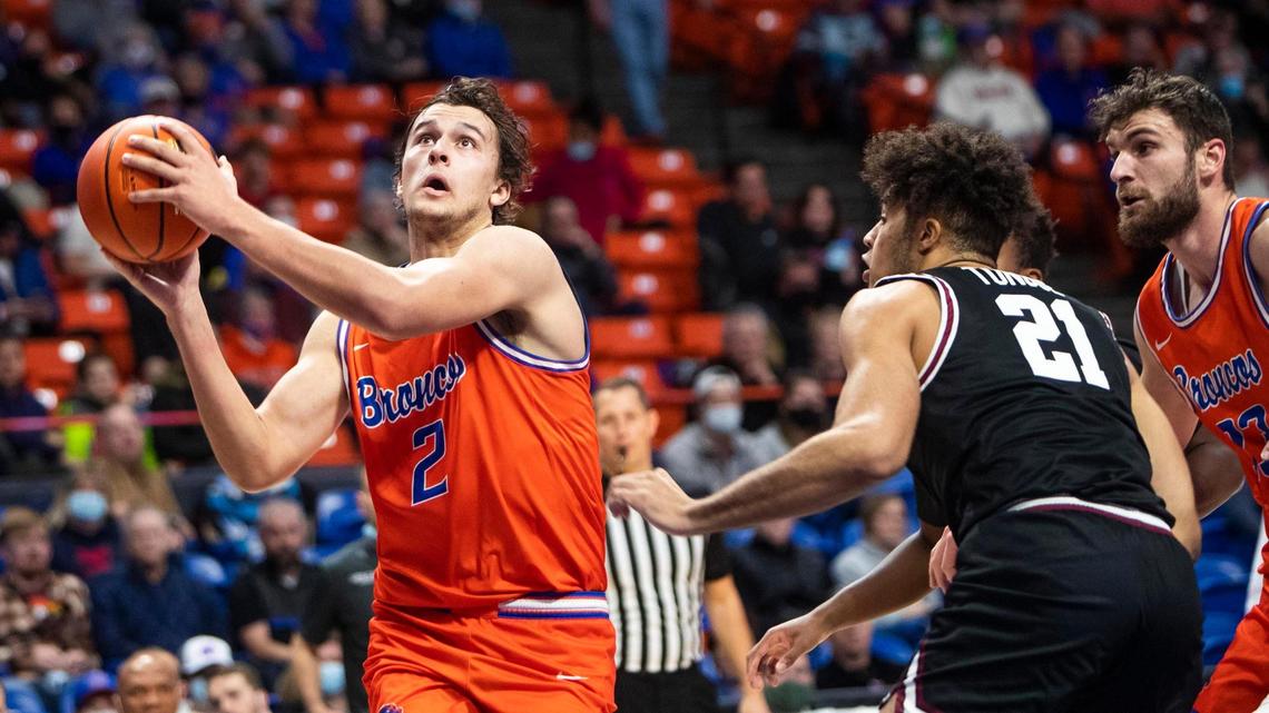 Boise State forward Tyson Degenhart finds a lane defended by Santa Clara forward Camaron Tongue in the first half Dec. 14 at ExtraMile Arena in Boise.