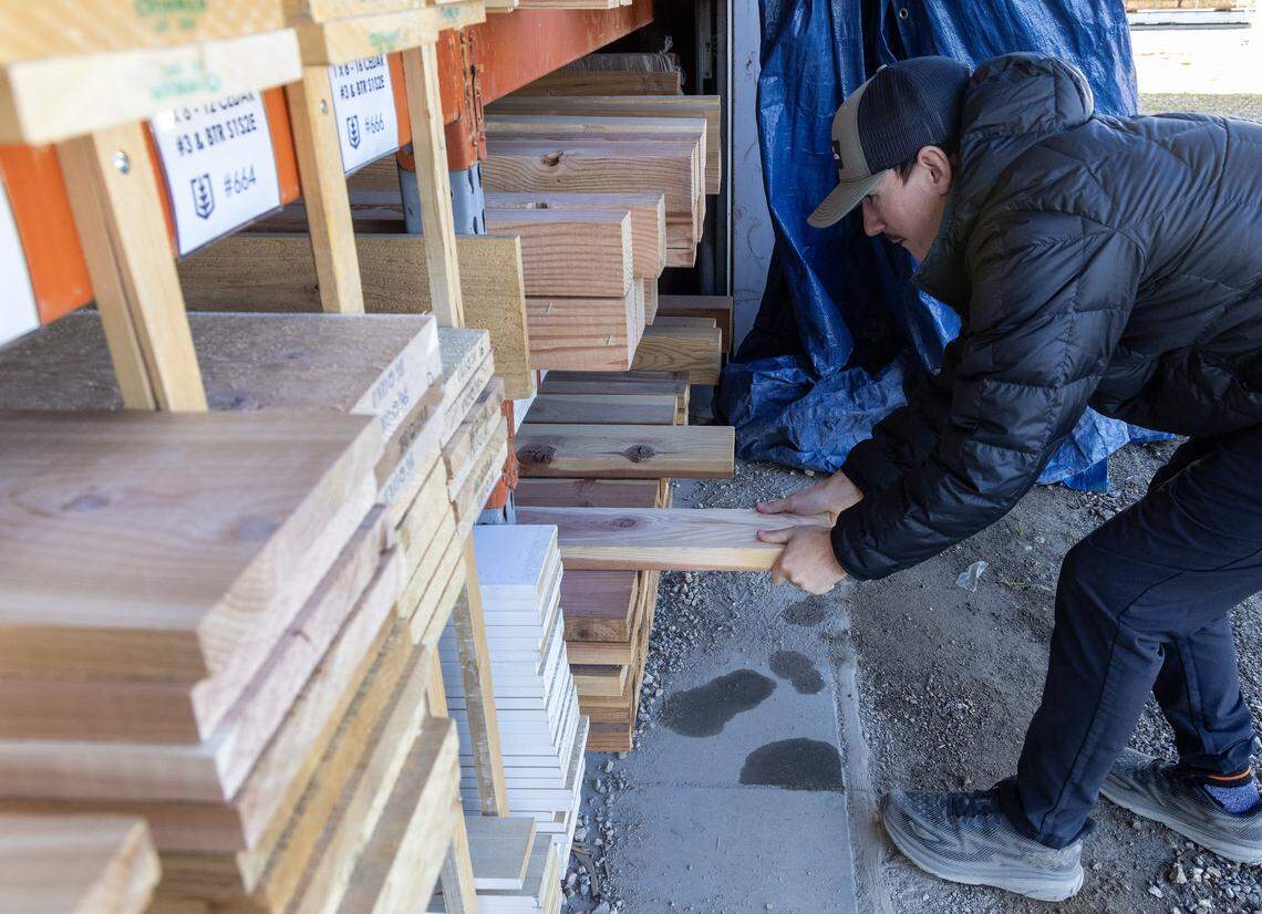 Dane Perrin organizes wood at Capital Lumber in Boise, Oct. 30, 2025. The business is 120 years old and has been in the Perrin family for the past 51 years.