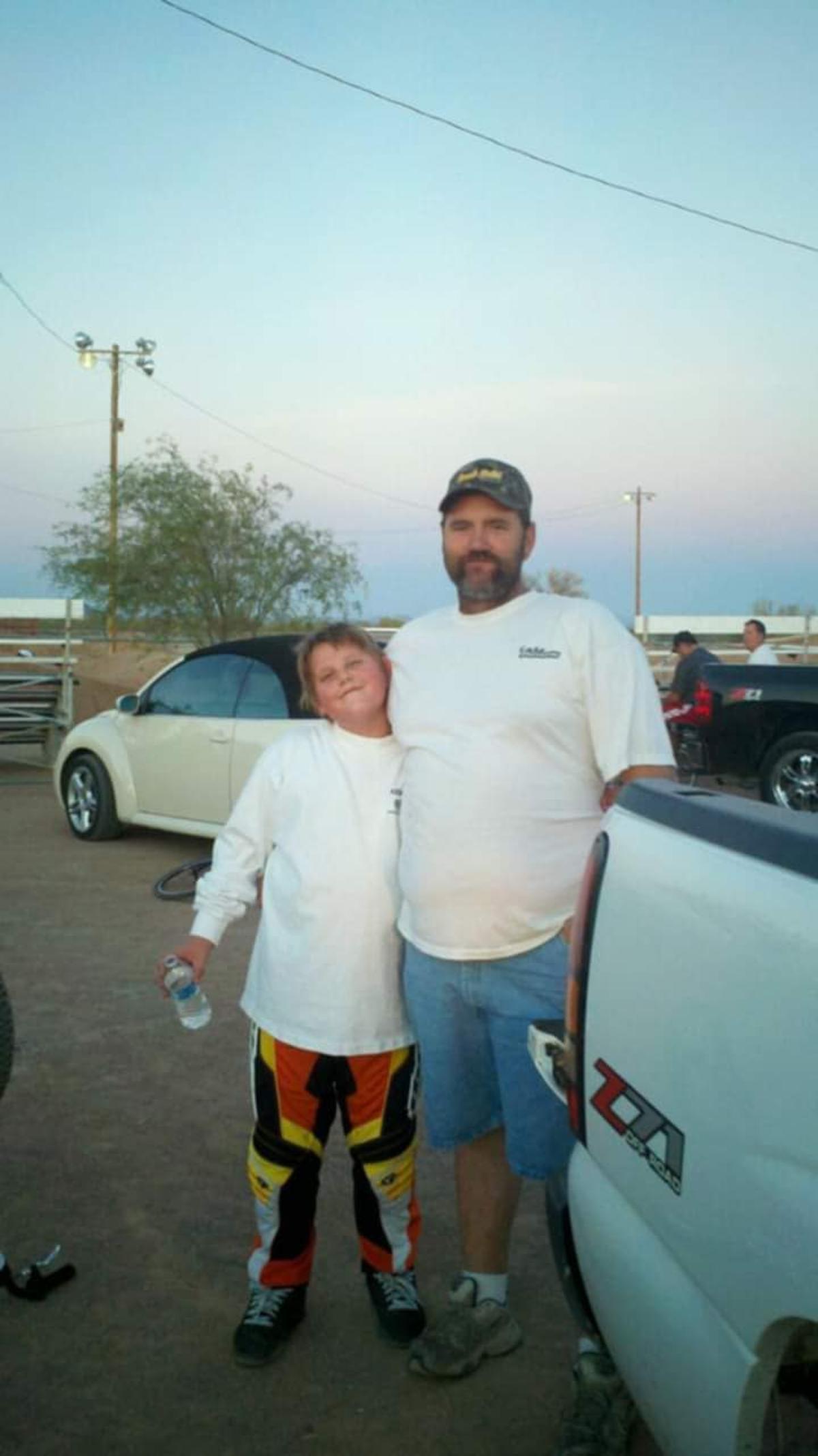 Justin Friesner, left, stands next to his father, Douglas Friesner.