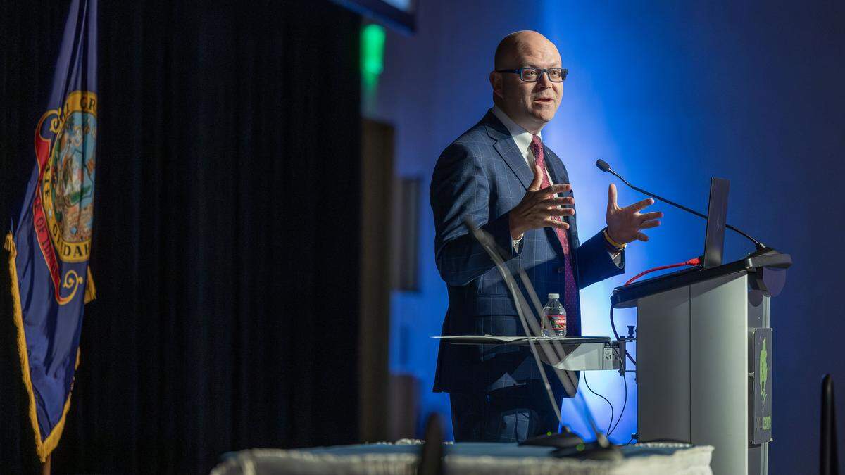 Idaho Secretary of State Phil McGrane presents data on money spent by lobbyists, both inside and outside of Idaho, to influence lawmakers while addressing the Associated Taxpayers of Idaho during a conference in Boise, Wednesday, Dec. 3, 2025.