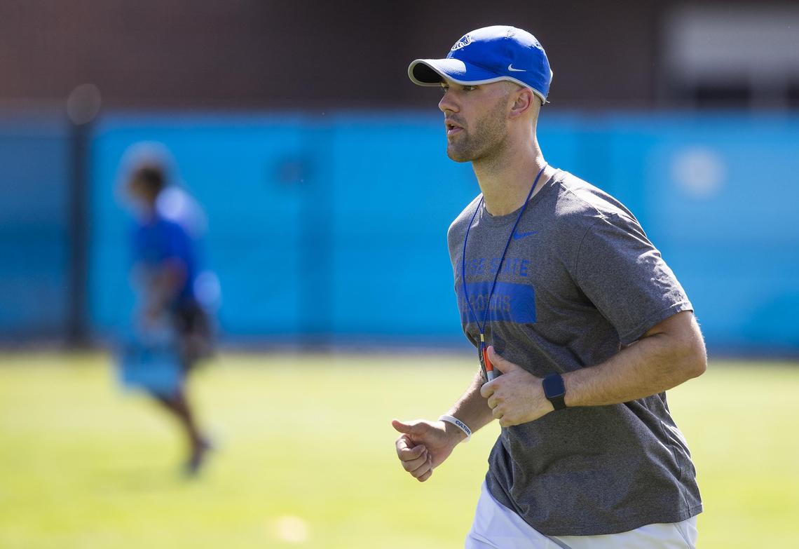 Boise State linebackers coach Zac Alley works with his players on the first day of fall camp Friday, Aug. 2, 2019.
