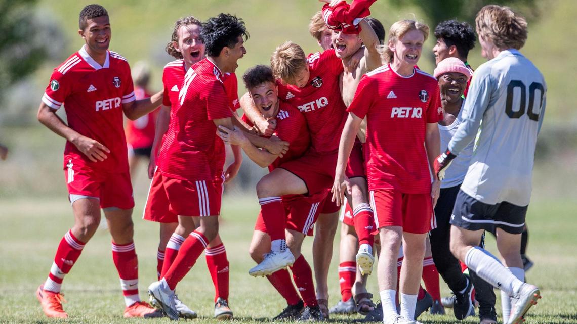 The U-19 Boise Timbers celebrate their 4-3, overtime win over the U-20 Boise Timbers in the Idaho State Cup championship Monday at the Simplot Sports Complex in East Boise.