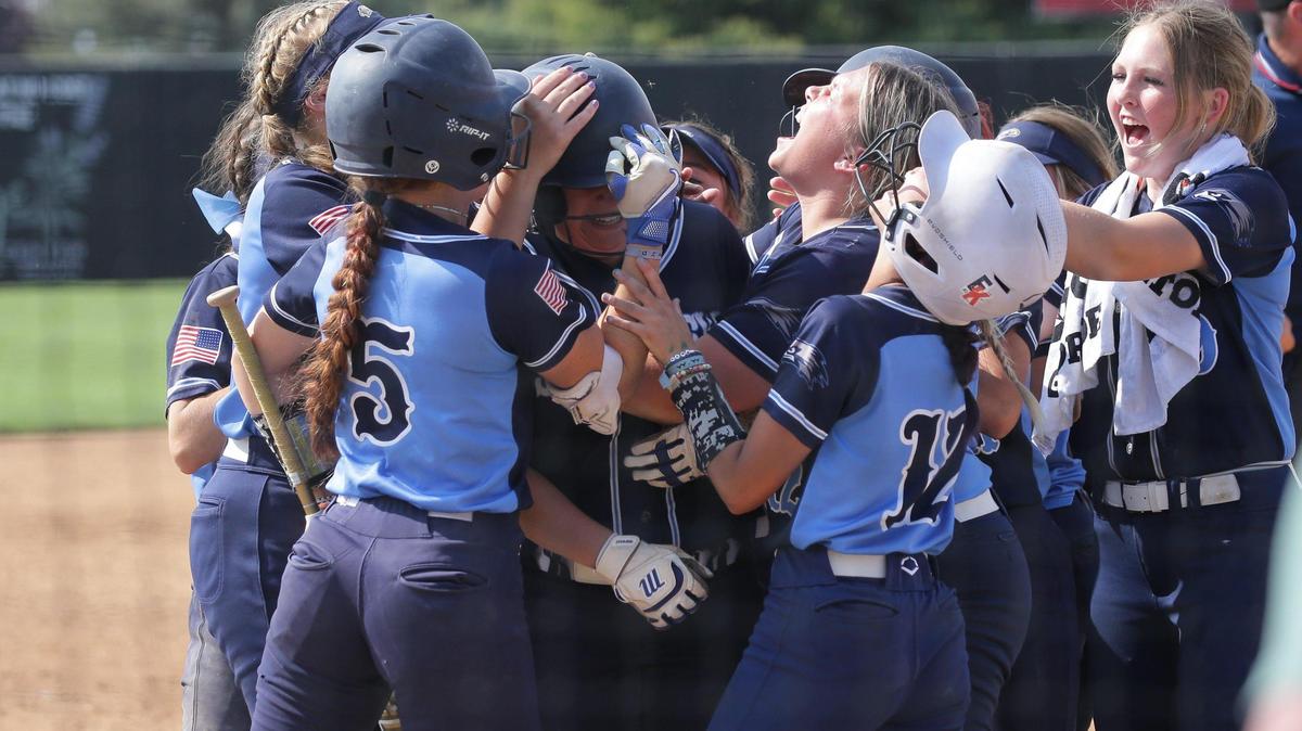Skyview celebrates a home run by Marae Holloway in the first game of the 4A state championship series against Pocatello in Twin Falls. The Hawks won the first game 7-3 to force a finale in the double-elimination tournament, and won that game 12-10.