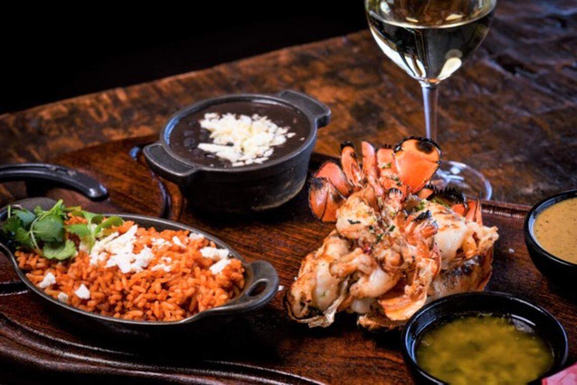 Two grilled Maine lobster tails, Puerto Nuevo-style, served with black beans, cilantro rice, tortillas and salsa ($42).