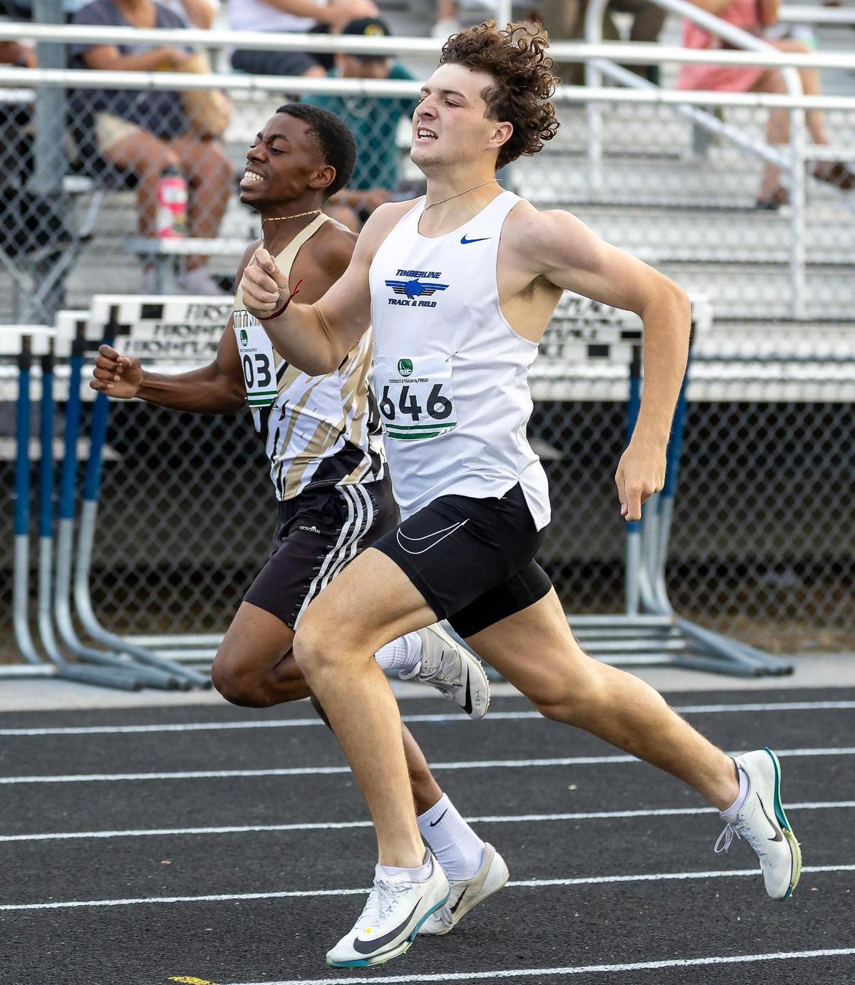 Tmberline’s Ethan Kirkendall edges Kuna’s Izaki Abongela for first place in the boys 400 meters at last year’s 6A District Three meet at Meridian High School.