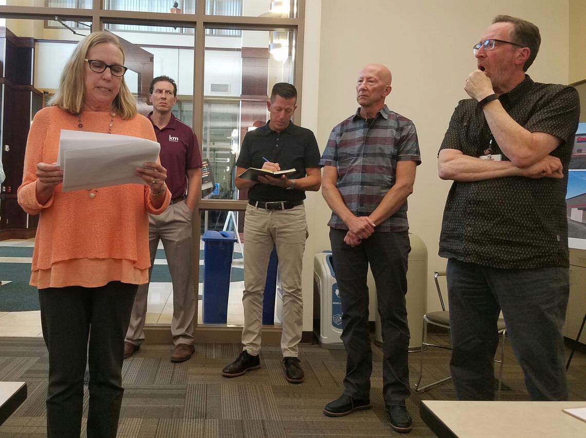 Jane Albert, who lives in a neighborhood near the planned Meridian Costco store, tells company representatives that neighbors want the store to blend into the neighborhood. She says they favor the use of wood beams and cultured stone, a pitched roof and broken roof lines to provide visual interest. She says pergolas (columns supporting a roof that is typically open, with rafters) would add visual impact. So would planters in front of the building instead of bollards (short posts).