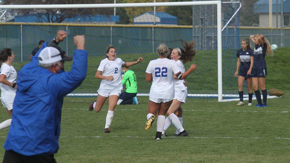 Timberline’s Hayden Wilsey, right, celebrates her golden goal in double overtime that lifted the Wolves to a 2-1 win over Lake City in the first round of the 5A girls soccer state tournament Thursday at Coeur d’Alene High.