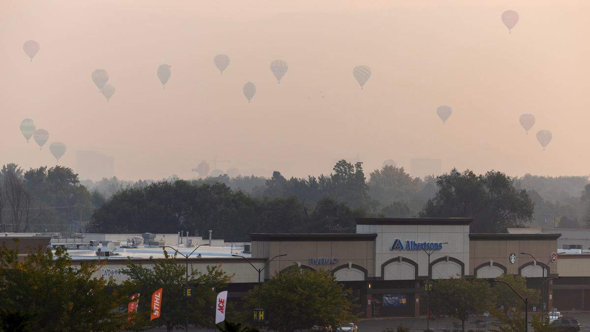The smoke didn’t deter viewers from turning out Friday morning for a hazy balloon launch.