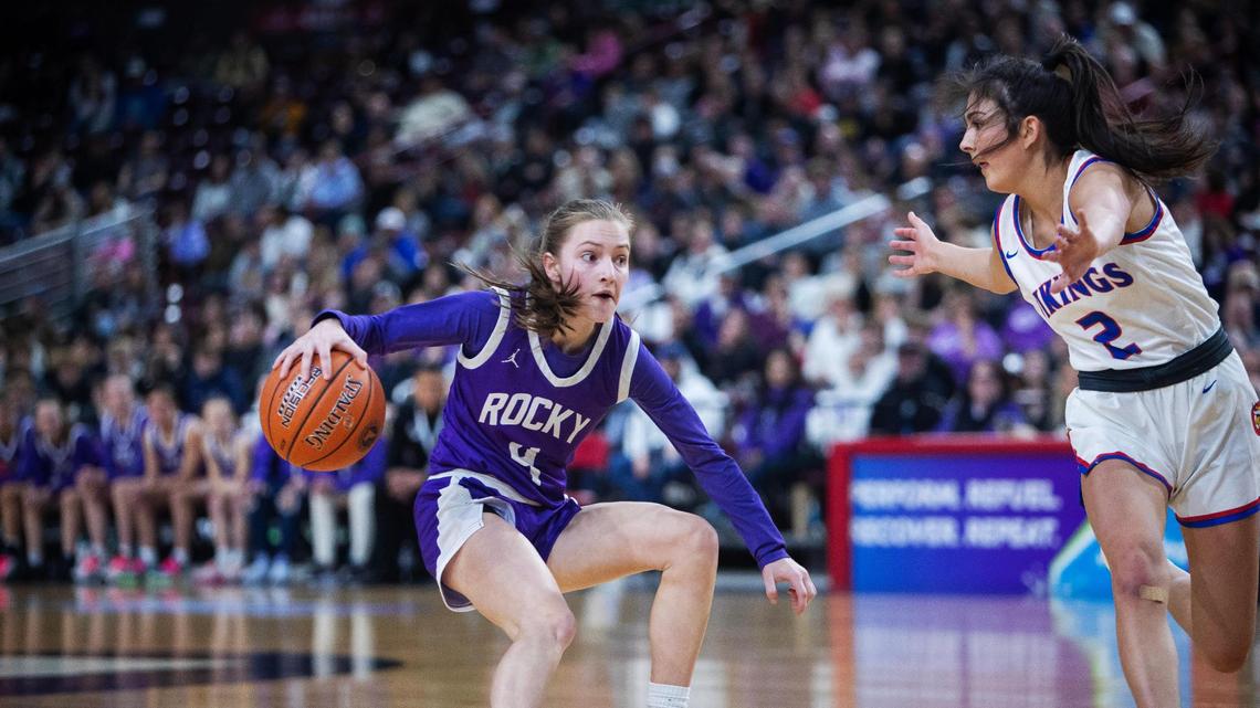 Rocky Mountain senior Zoe Archibald tries to find a way around Coeur d’Alene junior Maddie Mitchell in the 5A state championship game Saturday. The Vikings ran away with a 65-27 win for their first state title since 2014.