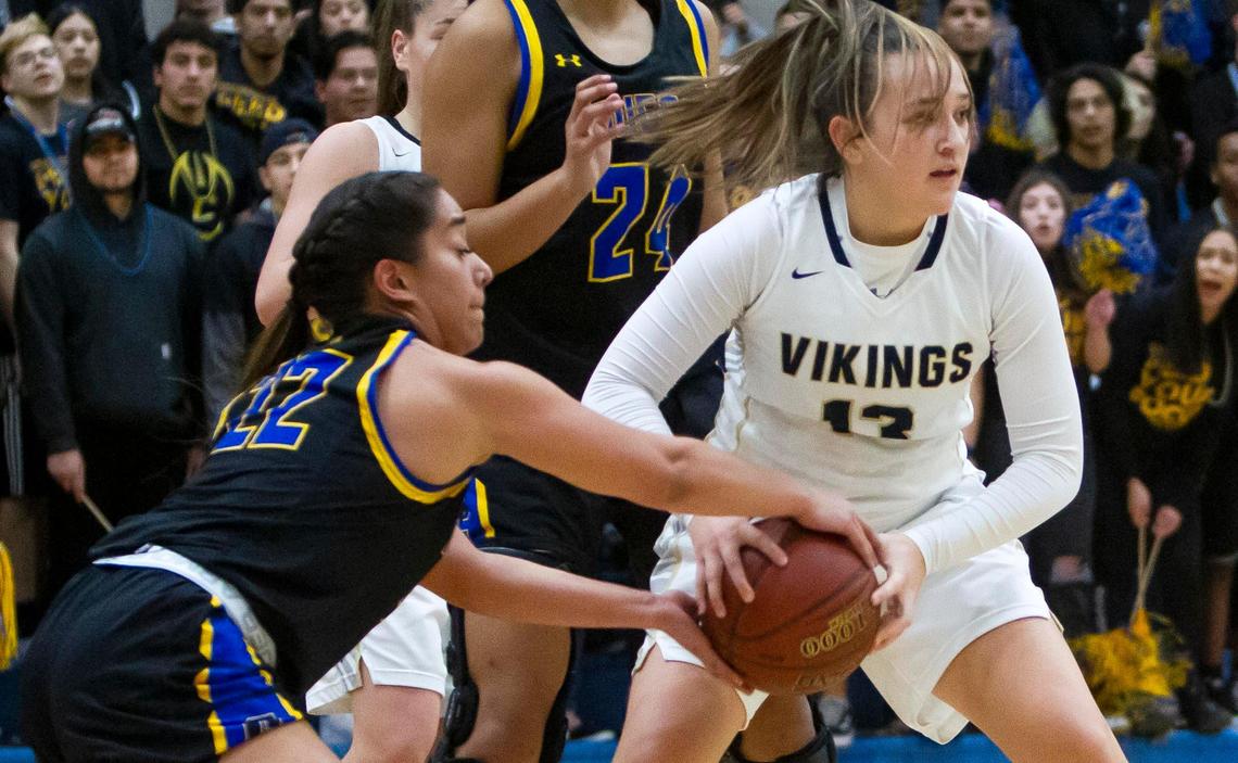 Caldwell senior Katrina Vallejo steals a defensive rebound from Middleton’s Zoey Moore during the 4A district championship last week.