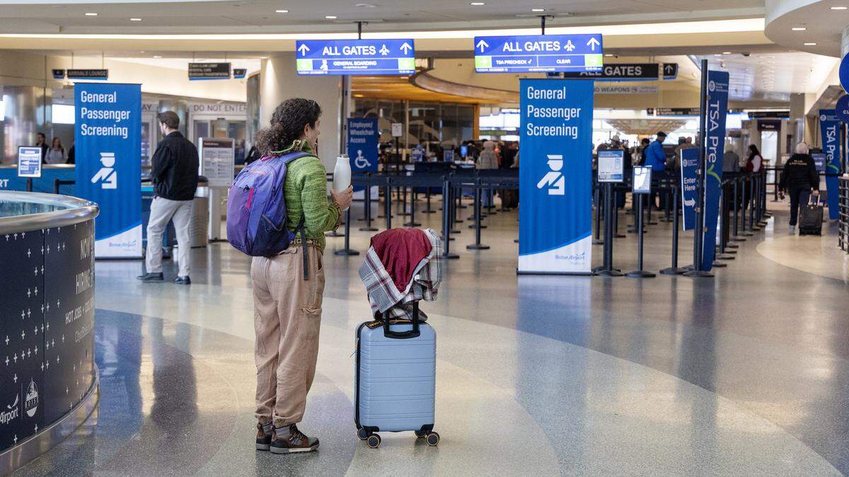 A passenger stands outside of the TSA screening area at the Boise Airport, Dec. 16, 2025.