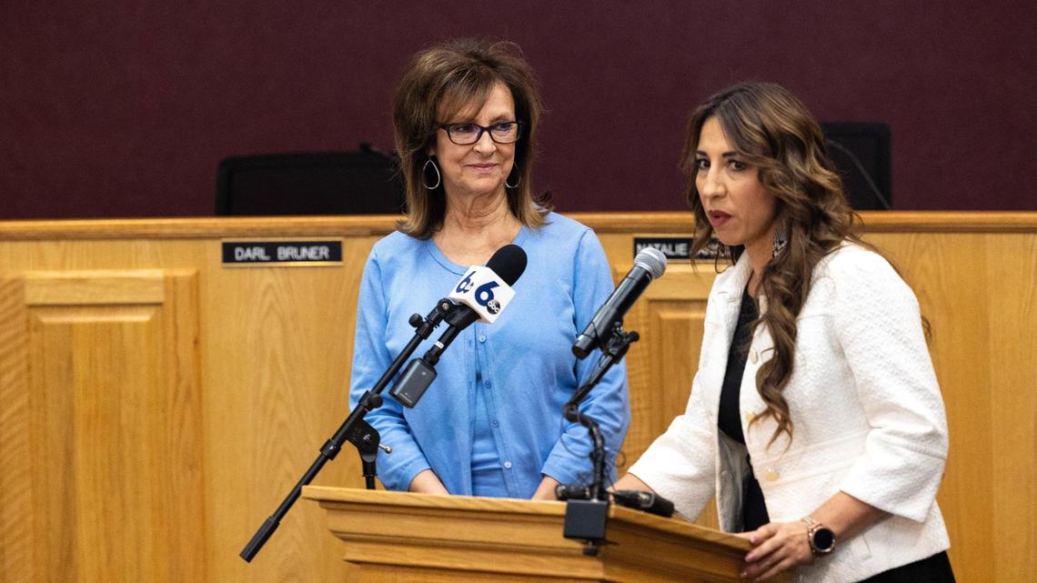 Nampa Mayor Debbie Kling stands at left as Mari Ramos, right, translates into Spanish information during a 2023 press conference about the Hispanic Cultural Center.