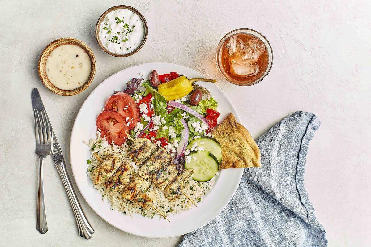 The Chicken Kebob Feast, anchored by two kebobs served with Taziki Sauce.