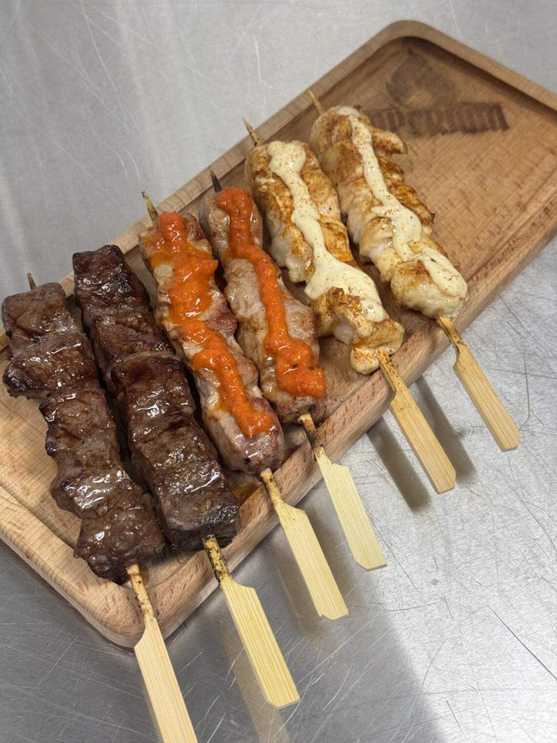 Charcoal-grilled meats are the menu focus.