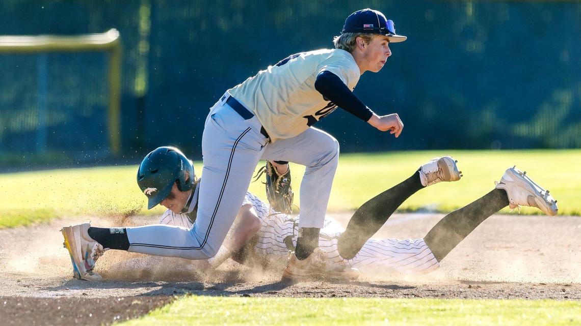 Middleton’s Kellen Viehweg tags out Eagle senior Brady Barowsky at third base Wednesday during Game 2 of the 5A District Three baseball championship series at Eagle.