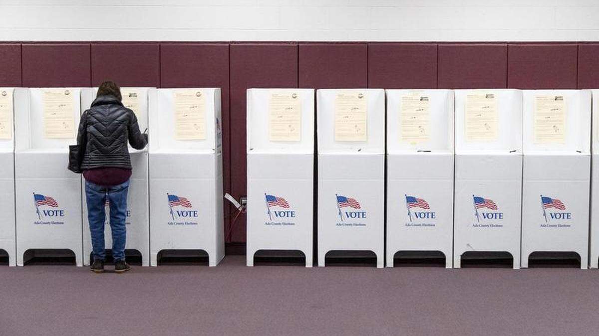 Patricia Dancer votes in the Boise mayoral runoff election Tuesday, Dec. 3, 2019, at Riverglen Junior High School, where voter turnout was estimated to be lower than on Election Day in November.