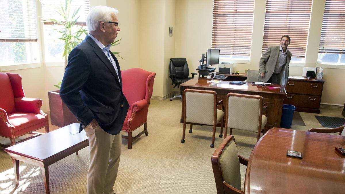 Outgoing Boise State President Bob Kustra visits his old office and interim president Martin Schimpf on Friday. Kustra's tenure started in 2003 when Boise State was a commuter school of roughly 18,500 students. Under his leadership, the school has grown to more than 24,000 students.