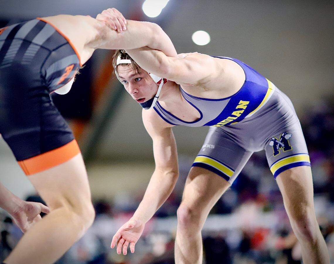 Meridian senior Jason Mara looks for an opening Saturday during his 152-pound championship bout at the ICCU Dome in Pocatello.