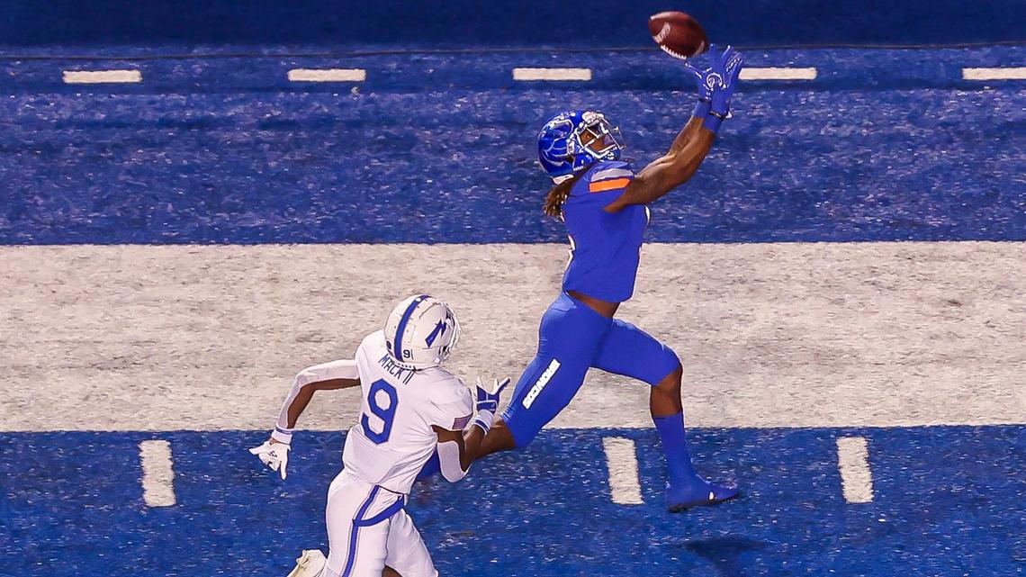 Boise State wide receiver Stefan Cobbs pulls in a 39-yard pass defended by Air Force cornerback Michael Mack in the first quarter Friday, Oct. 16, 2021 at Albertsons Stadium in Boise.
