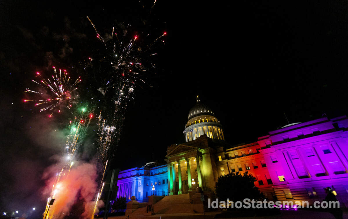 Fireworks shoot into the air next to the Idaho State House, which is illuminated in rainbow colors for the Boise Pride Festival on Friday, Sept. 9, 2022. The event continues through Sunday.