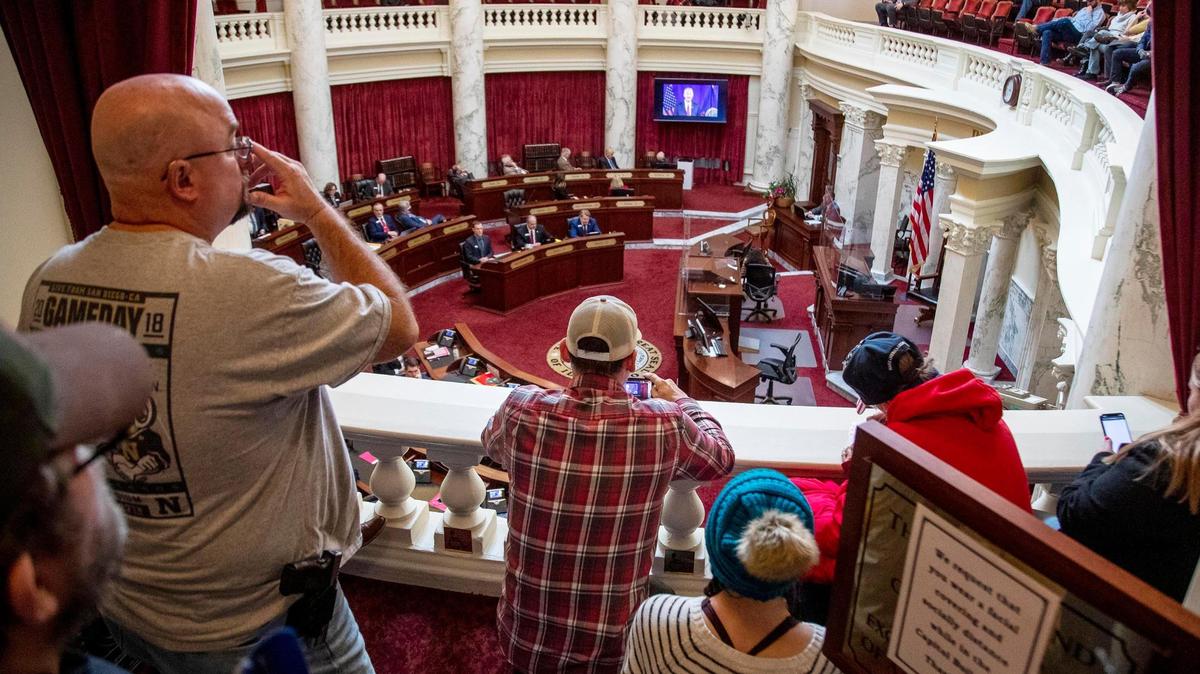 A group of onlookers watch Gov. Brad Little’s virtual State of the State address from the Senate Chamber gallery in January at the Statehouse in Boise.