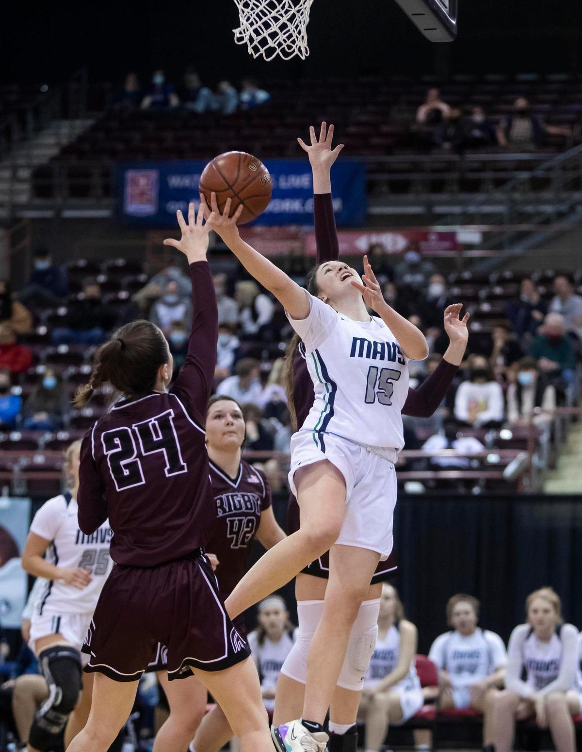 Mountain View junior Natalie Oyler scores on a baseline drive against Rigby on Friday at the Idaho Center.