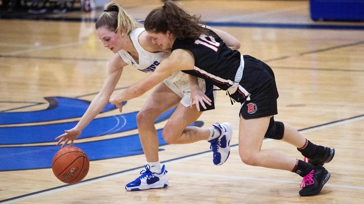 Timberline junior Lauren McCall maintains control while drawing a foul from Boise senior Ella Nelson on Tuesday.