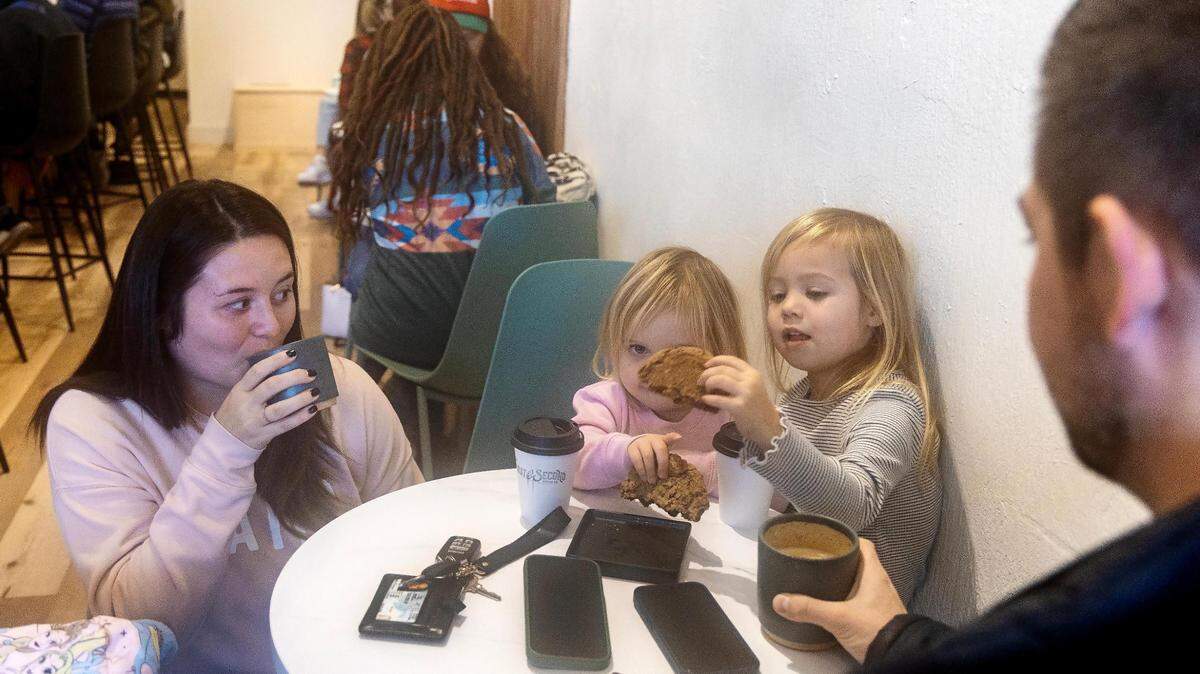 Heather Reidinger, left, her daughters Paisley, 2, Brylee, 4, and husband Zach Reidinger enjoy cookies and hot beverages Dec. 20 at new coffee shop First & Second Coffee Co. in downtown Nampa.