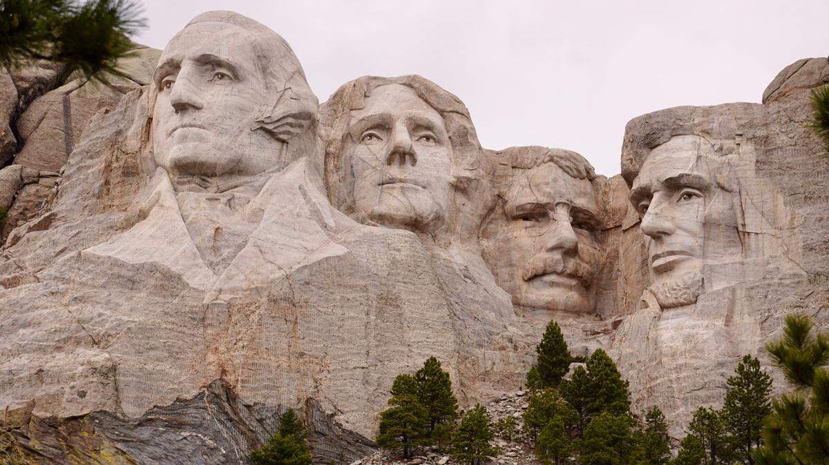 A trail leads to the base of Mount Rushmore, which provides a closer look at the carvings.