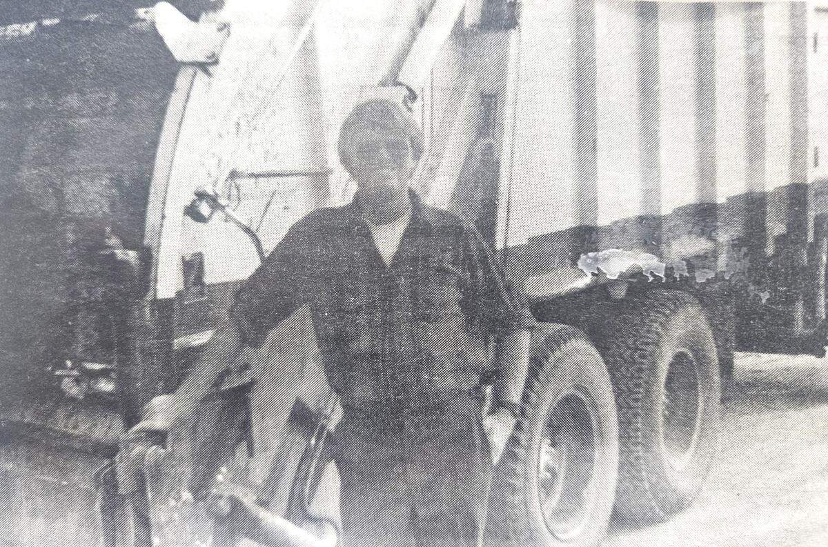 Tim Gordon, owner of J&M Sanitation, poses behind one of his early garbage trucks in this undated photo that appeared in the Kuna Melba News with a story about the Kuna landfill closing.
