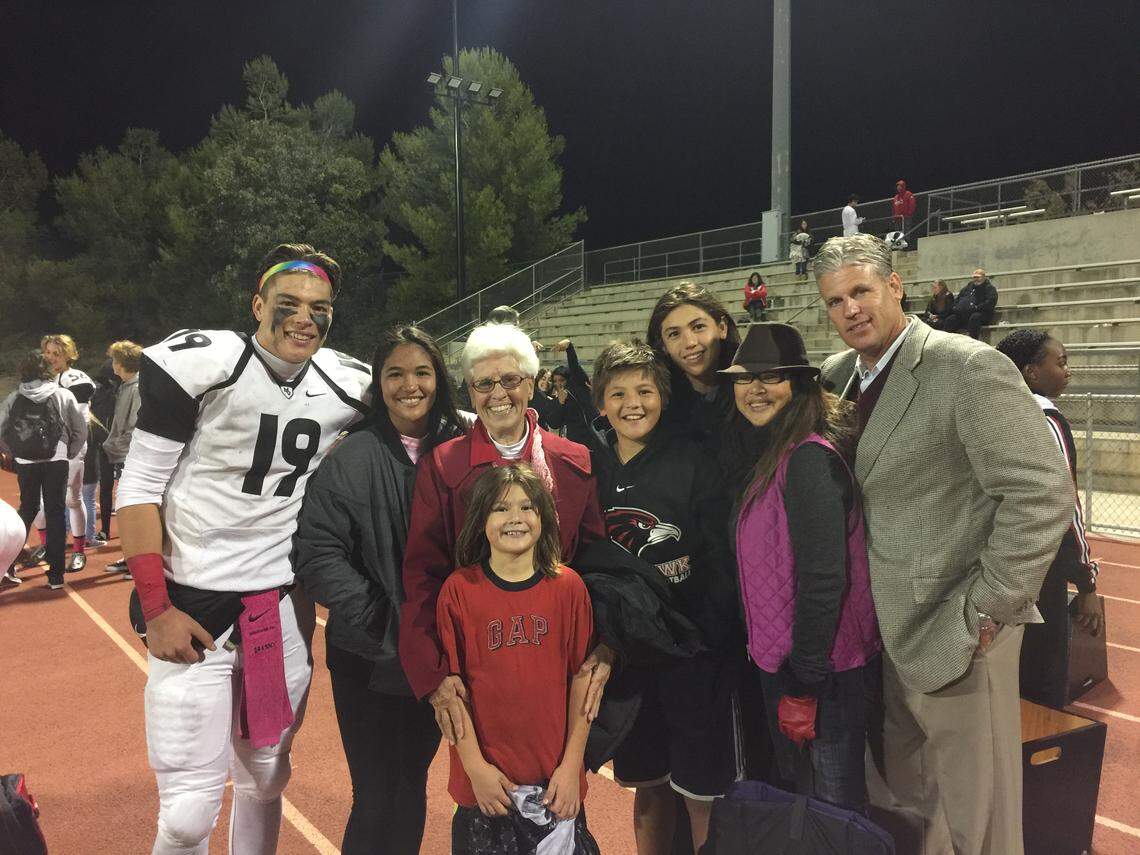 Boise State quarterback Hank Bachmeier, far left, and his dad, Michael, far right.