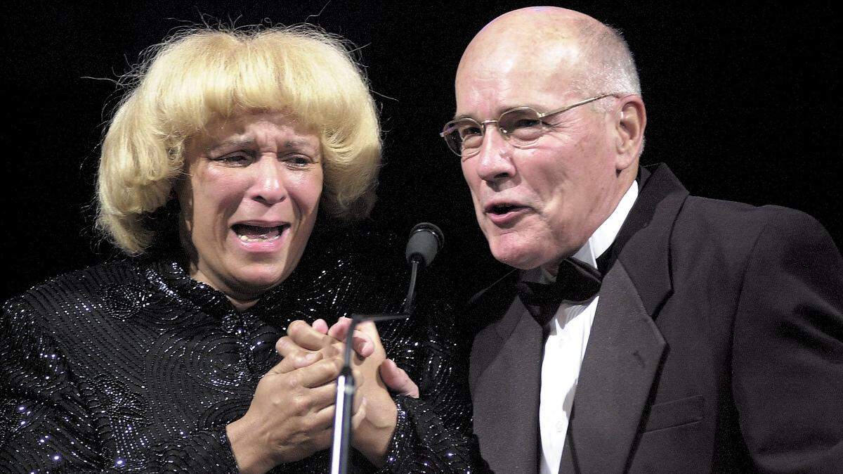 In this Idaho Statesman file photo, Erica Wright breaks down while being presented with the President’s Award by Myron Finkbeiner at the World Sports Humanitarian Hall of Fame induction ceremony at the Brandt Center at Northwest Nazarene University. Finkbeiner, the hall’s founder, died on June 27 at the age of 88.