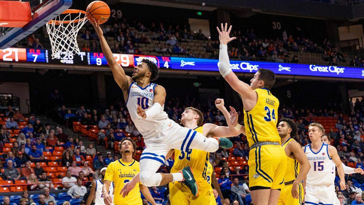 Boise State guard Marcus Shaver Jr. drives to the hoop through South Dakota State’s defense on Wednesday at ExtraMile Arena in Boise.