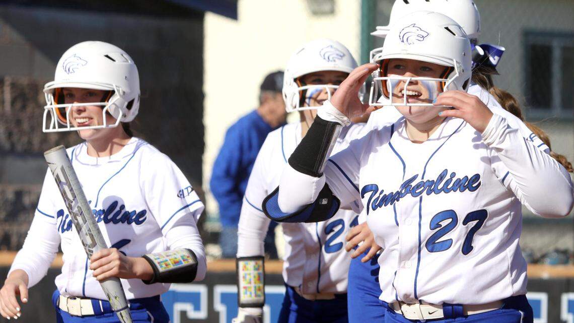 Timberline freshman Delaney Wright, right, celebrates after her two-run double capped a late rally in the Wolves’ 4-1 win over Kuna on Tuesday at Timberline High. She also scored on the play thanks to a throwing error.