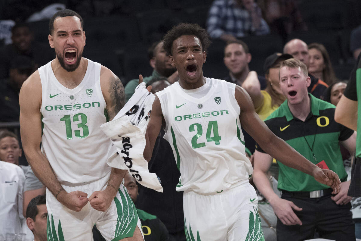 Oregon forward Paul White, left, and forward Abu Kigab, right, celebrate during a game against Syracuse in the 2K Empire Classic on Nov. 16, 2018, at Madison Square Garden in New York. Kigab is transferring to Boise State.