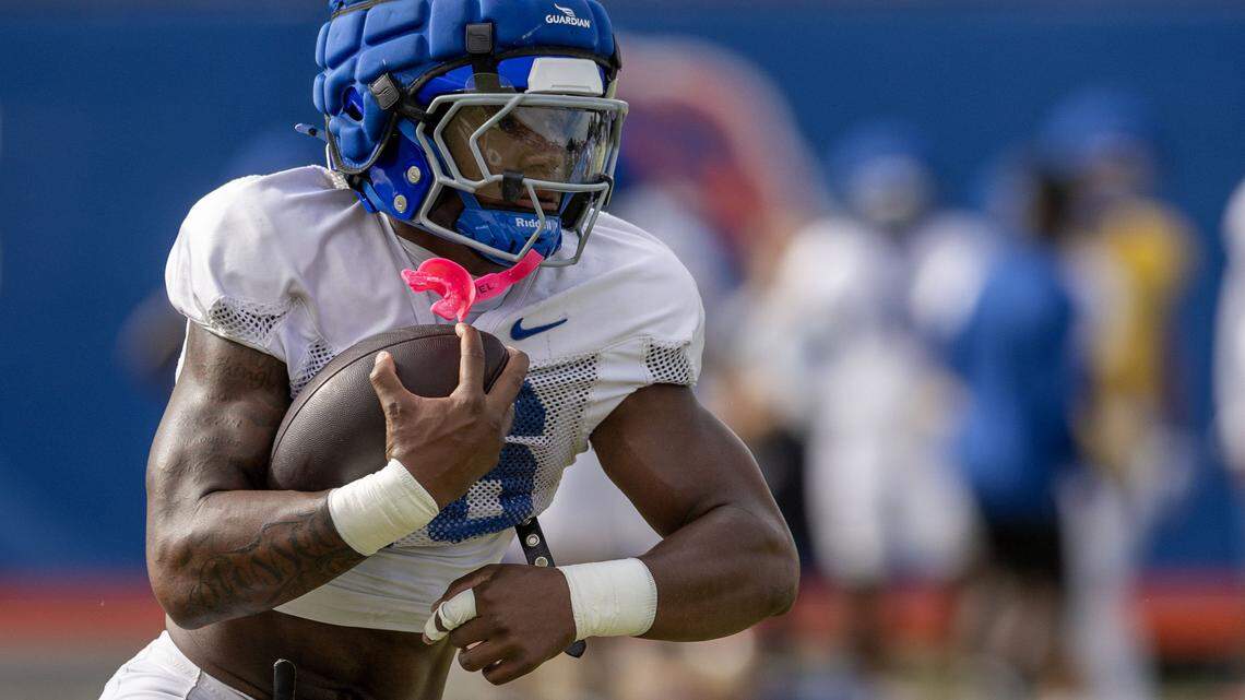 Boise State running back Sire Gaines takes a handoff during drills at the Broncos' fall camp in Boise, Saturday, Aug. 9, 2025.