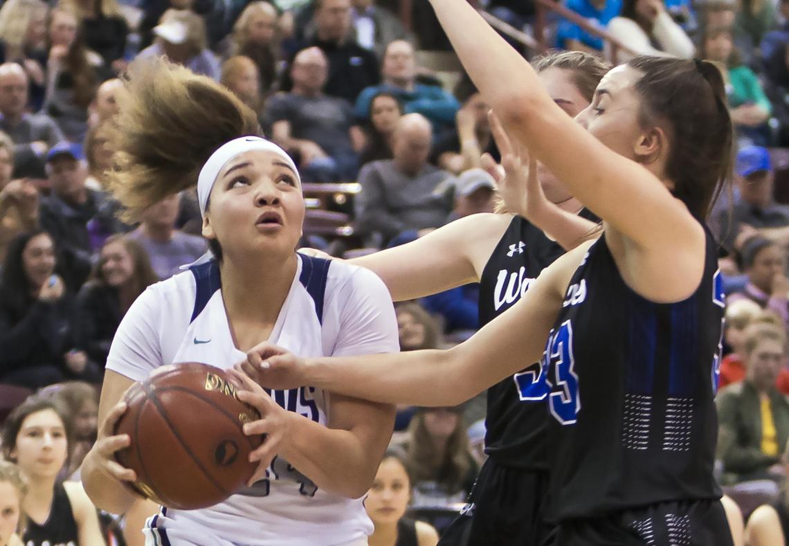 Mountain View sophomore Trinity Slocum drives to the hoop guarded by Timberline’s Ashlyn Ascuena-Mercil in the state 5A girls basketball semifinals Friday, Feb. 15, 2019 at Ford Idaho Center in Nampa.