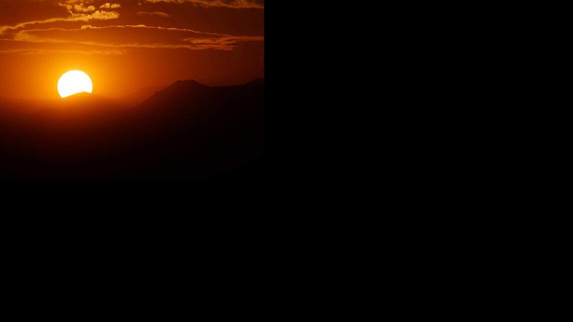 Two people on a backcountry skiing and hiking trip spent a night in a cold drainage ditch after a lightning storm drove them into rugged terrain, Colorado rescuers say.