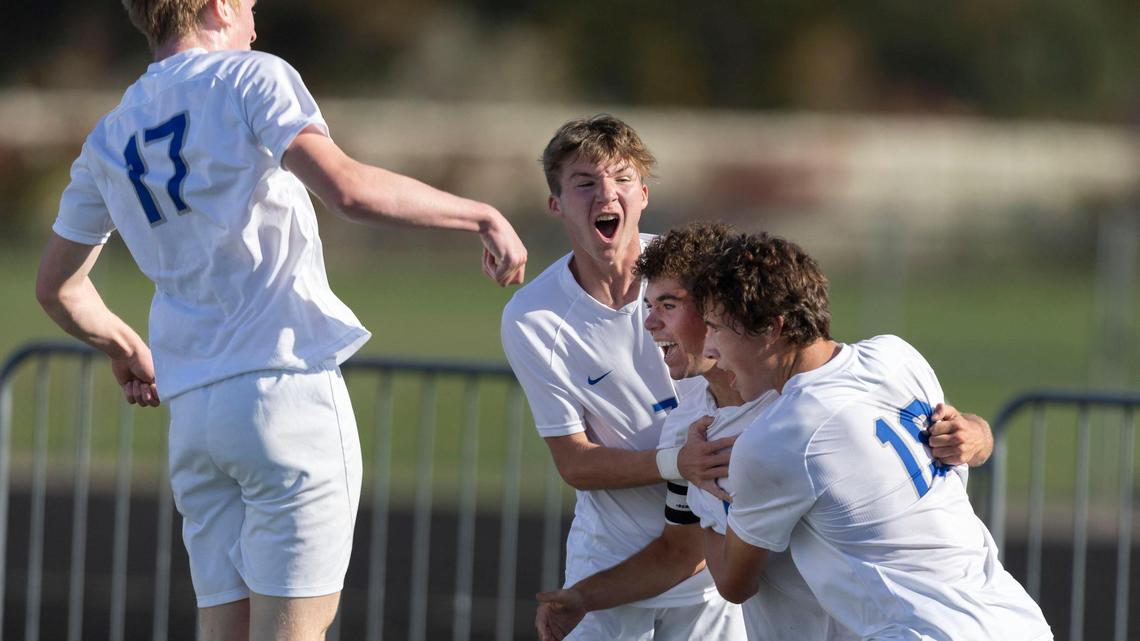 Timberline forward Zach Taylor is rushed by his teammates after scoring the only goal against Boise in the semifinals of the 5A boys soccer tournament Friday.