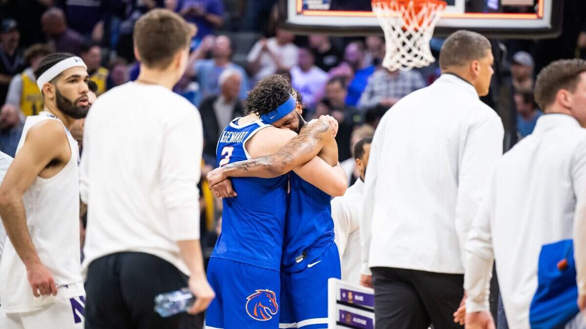 Boise State forward Naje Smith, right, hugs teammate Tyson Degenhart after their 75-67 loss to Northwestern on Thursday in the NCAA Tournament at Golden 1 Center in Sacramento, California.