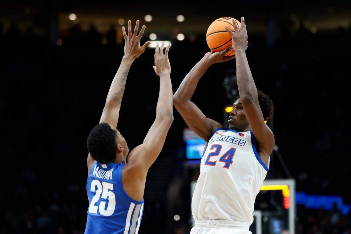Boise State forward Abu Kigab, right, shoots over Memphis guard Jayden Hardaway. Kigab scored all 20 of his points in the second half of Boise State’s 64-53 loss.