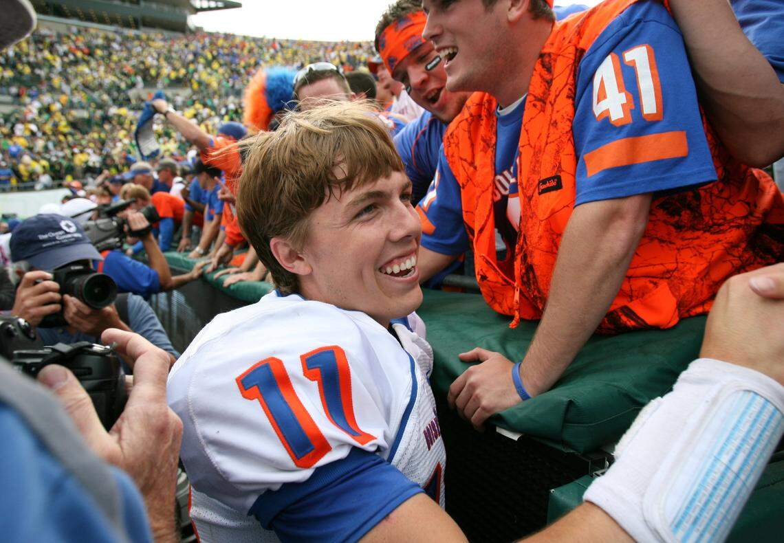 Boise State quarterback Kellen Moore celebrates with fans after beating Oregon at Autzen Stadium in Eugene in 2008.
