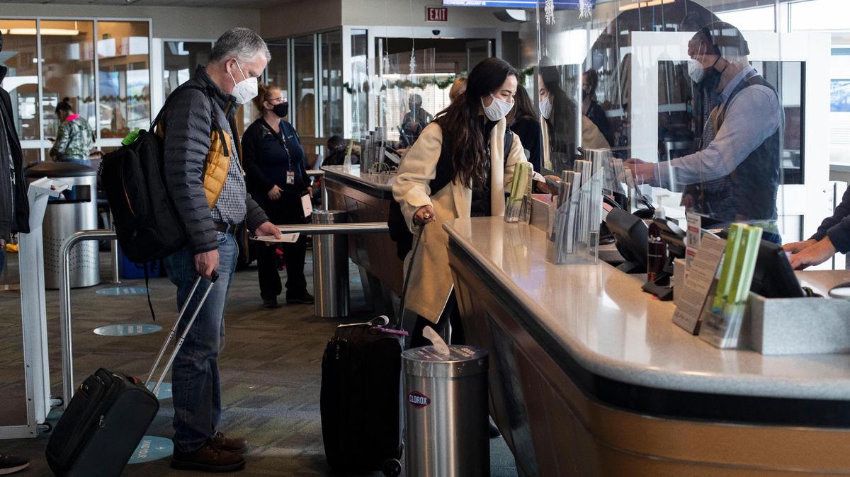 Passengers prepare to board a flight at the Boise Airport in January. The airport is adding an eighth commercial air carrier and new route to California starting in May.